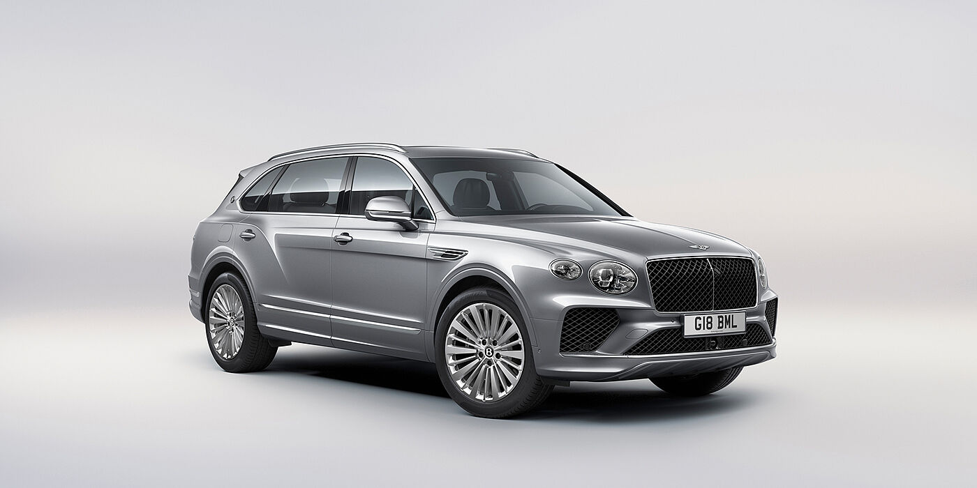 Bentley Jeddah Bentley Bentayga Extended Wheelbase luxury SUV front three quarter view in Moonbeam paint with 21 inch five spoke painted wheels