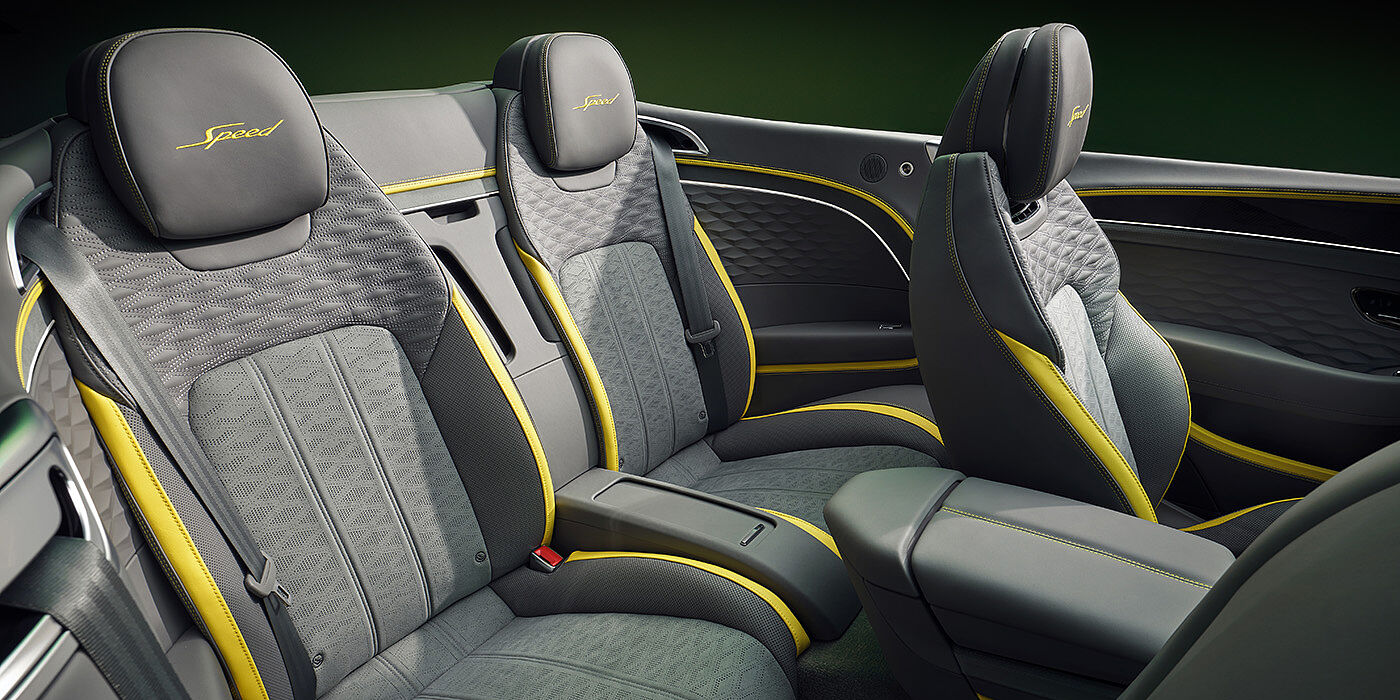 Bentley Jeddah Bentley New Continental GTC Speed convertible rear interior with unique Speed colour split in Gravity Grey and Cyber Yellow hide colours, and contrast stitched headrest emblems 