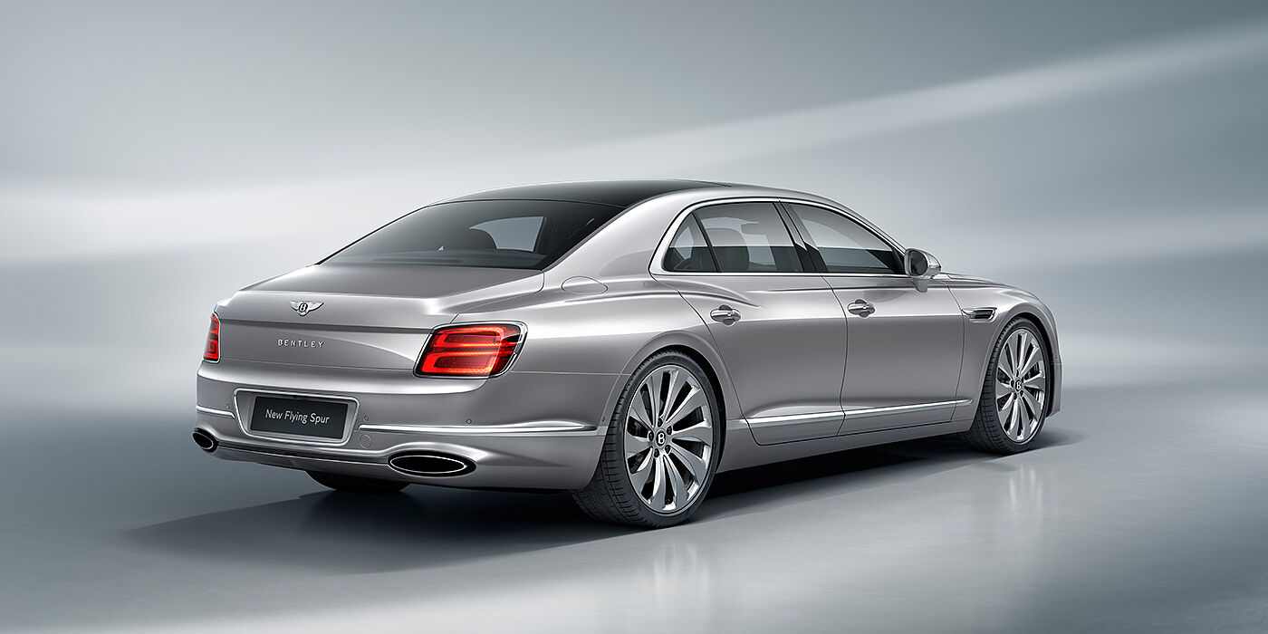 Bentley Jeddah New Bentley Flying Spur sedan rear view in Silverlake paint with ten spoke wheels and chrome matrix grille