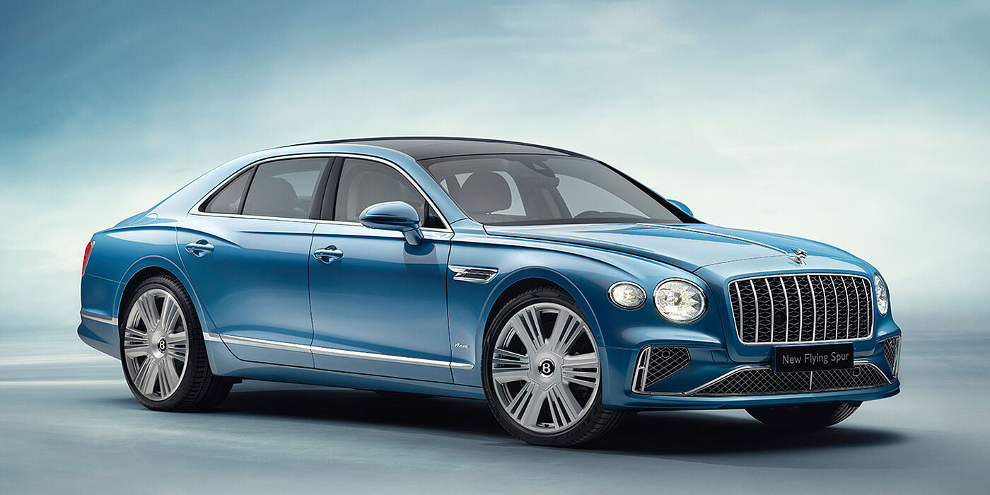 Bentley Jeddah New Bentley Flying Spur Azure sedan front view in Light windsor blue by Mulliner paint with 22 inch Azure wheels and chrome exterior details