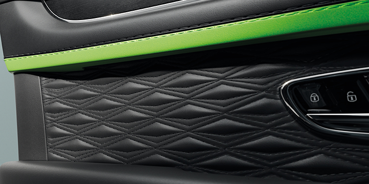 Bentley Jeddah Bentley Bentayga Speed SUV interior door detail with Diamond in Diamond stitched hide in Beluga black colour, with Black stained Crown Cut Walnut veneer
