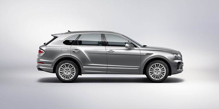 Bentley Jeddah Bentley Bentayga SUV side profile in Moonbeam silver paint against white background featuring 21 inch 5 spoke wheels