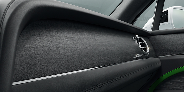 Bentley Jeddah Bentley Bentayga Speed SUV front dash close up in Hyper Green and Beluga black hides, with Black Stained Crown Cut Walnut veneer