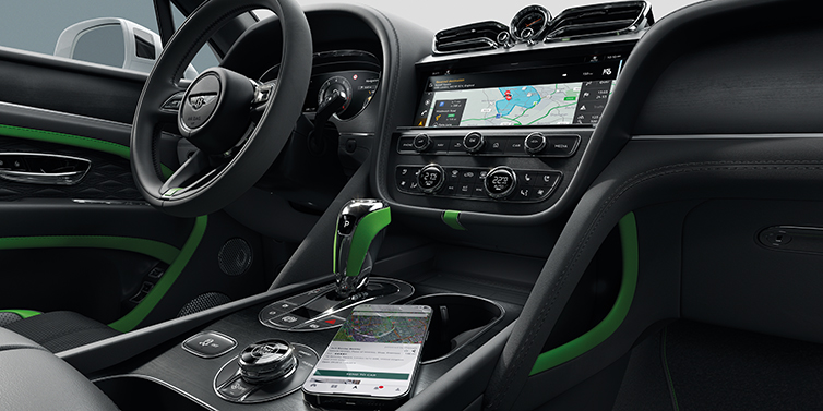 Bentley Jeddah Bentley Bentayga Speed SUV front cabin in Hyper Green and Beluga black hides, with Black Stained Crown Cut Walnut veneer